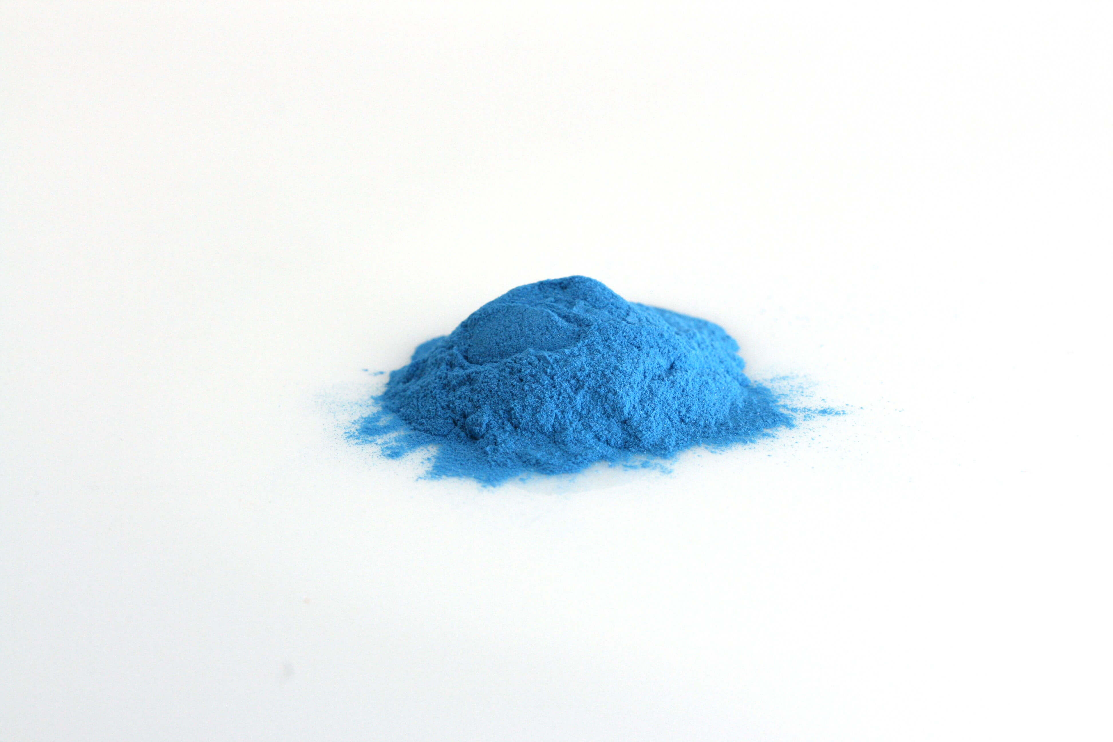 Blue All in one premium-Pile of Blue All in one premium Powder on white background-Excipient-Mix-Granules