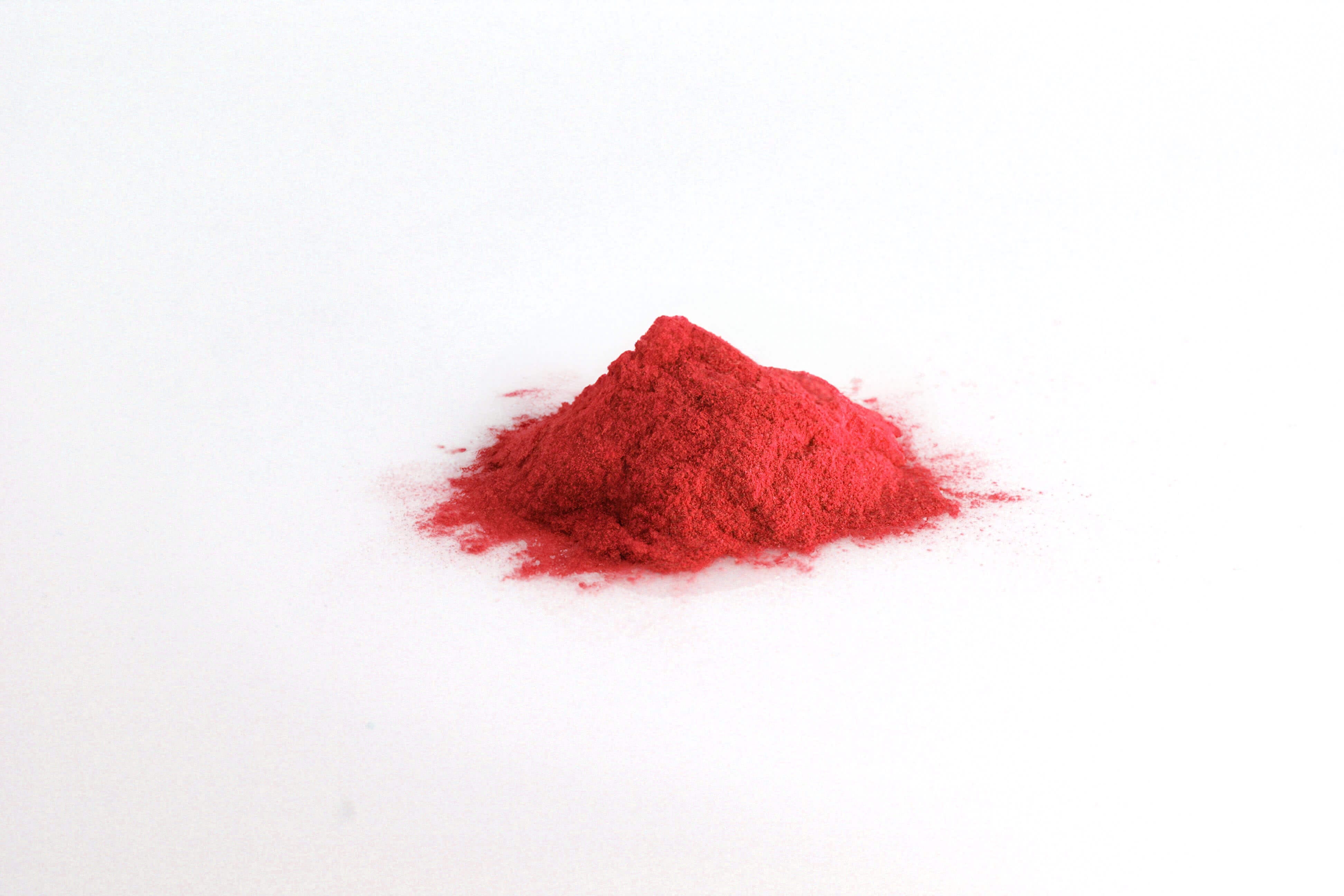 Red All in one premium-Pile of Red All in one premium Powder on white background-Excipient-Mix-Granules